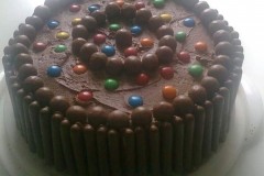 Chocolate cake with smarties, maltesers and chocolate fingers!
